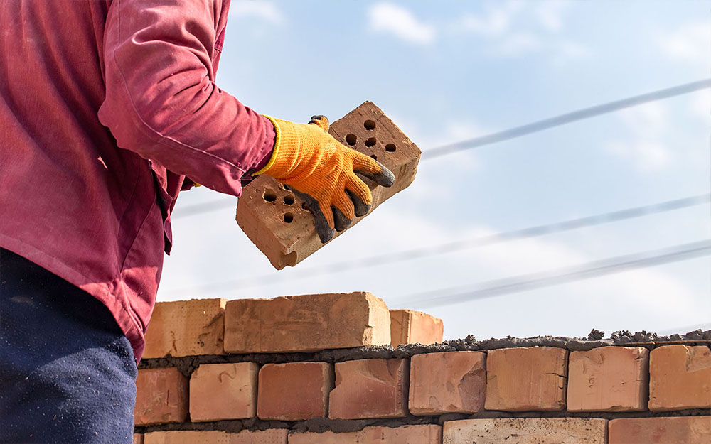 Bricklayer building extension